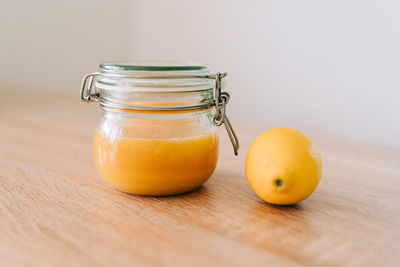 Close-up of juice in glass jar on table