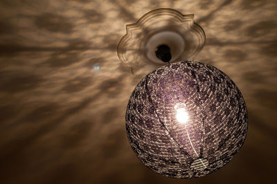 Low angle view of illuminated light bulb