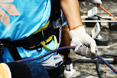 Rappellists preparing to descend a very tall building. salvador bahia brazil.