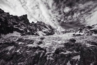 Scenic view of snow covered mountains against sky