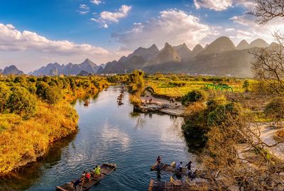 Scenic view of lake and mountains against sky