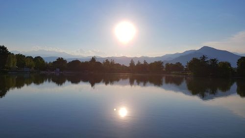 Scenic view of lake against sky during sunset