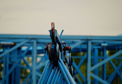 Close-up of metal railing against clear sky