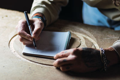 High angle view of man working on table