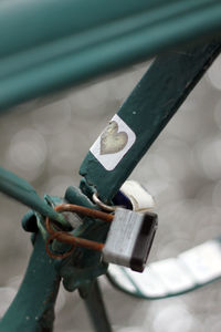 Close-up of padlock on railing