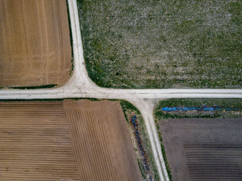 High angle view of road amidst field