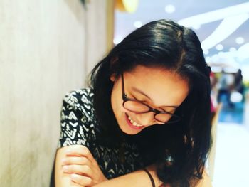 Portrait of smiling young woman at home