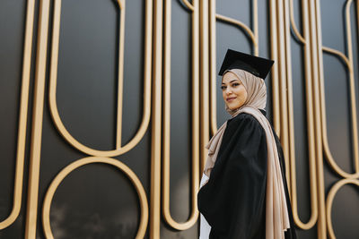 Smiling woman wearing graduation hat