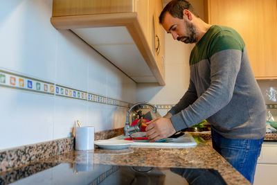 Side view of man working at home