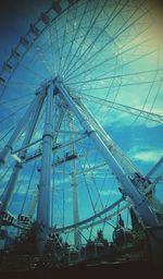 Low angle view of ferris wheel against sky