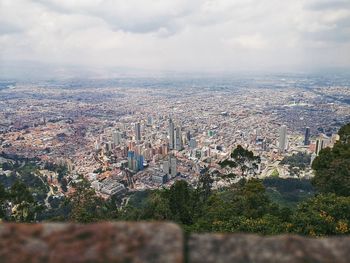 High angle view of trees and buildings against sky