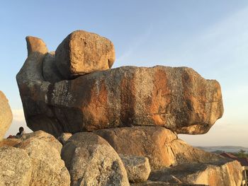 Stack of rocks on rock against sky, mwanza, the rock city. 