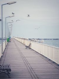 View of pier on sea against sky