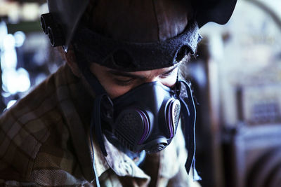 Worker in protective workwear at workshop