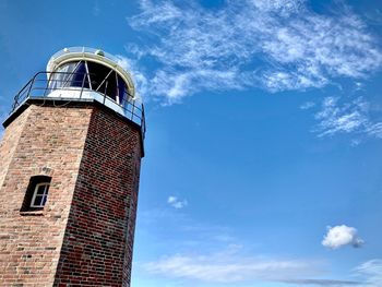 Low angle view of tower against blue sky