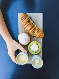 High angle view of food on table with hand