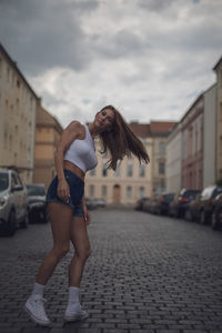 Side view of woman standing on street