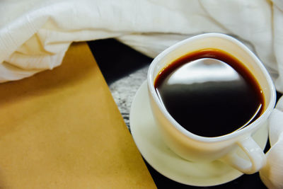 High angle view of coffee cup on table
