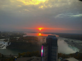 High angle view of buildings against sky during sunset