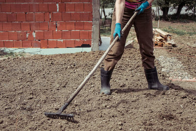 Low section of man working at construction site