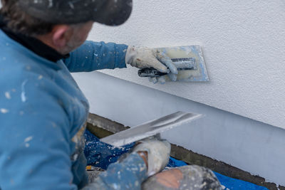 Midsection of man with dog