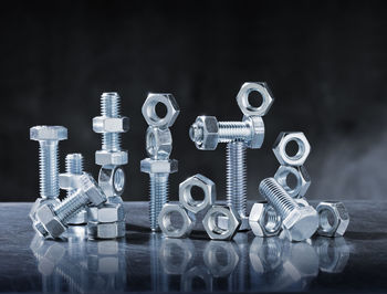 Close-up of nuts and bolts on table