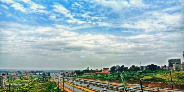 View of railway tracks against cloudy sky