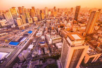 High angle view of modern buildings in city against sky