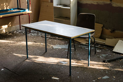 Abandoned table and chairs