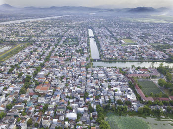 High angle view of crowd and buildings in city