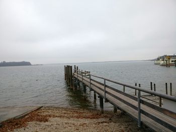 Pier over sea against sky