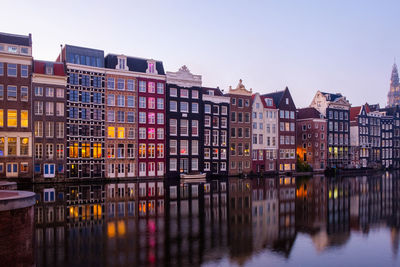 Amsterdam - a view of canal with a row of colorful houses in the background
