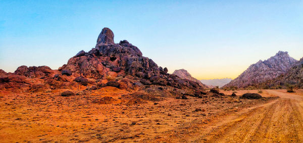 Rock formations in desert against sky