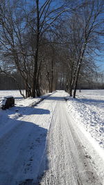 Snow covered landscape against sky