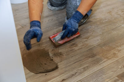 High angle view of men working on wooden table