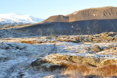 Scenic view of snowcapped mountains against sky