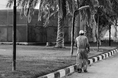 Full length rear view of man walking outdoors