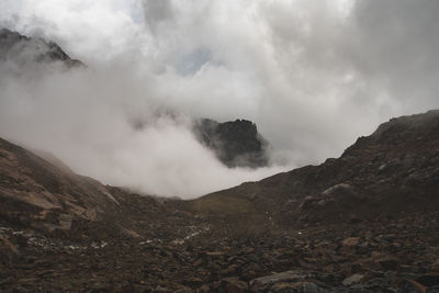 Scenic view of rocky mountains against sky