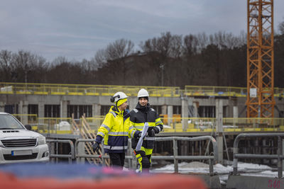 Engineers talking at building site