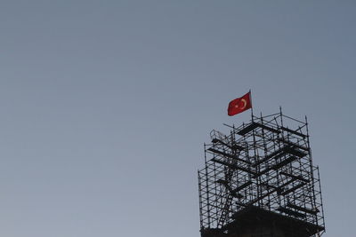 Low angle view of flag against clear sky