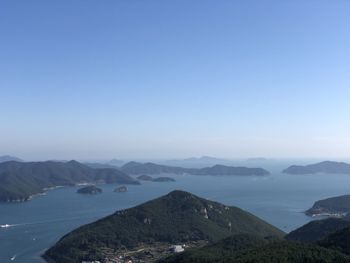 Scenic view of mountains against clear blue sky
