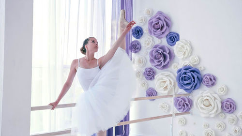 Young ballerina dancing in studio
