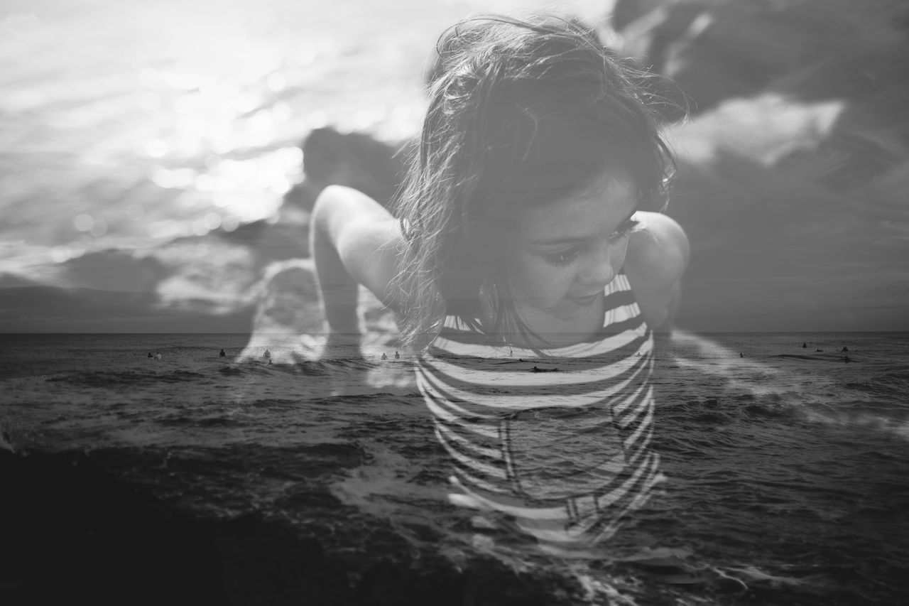 WOMAN SWIMMING IN SEA