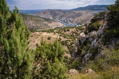 Scenic view of landscape and mountains against sky