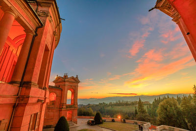 Low angle view of historic building against sky during sunset