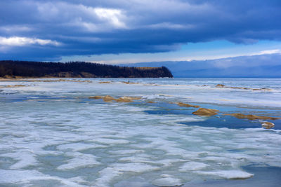 Scenic view of beach against sky