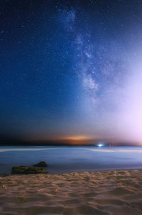 Scenic view of sea against clear sky at night