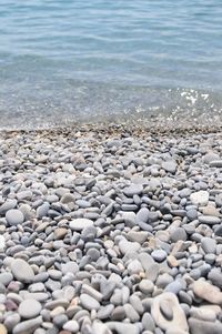 High angle view of pebbles on beach