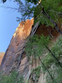 Low angle view of rock formation on mountain against sky