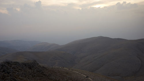 Scenic view of mountains against sky during sunset